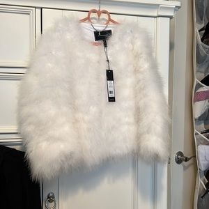 Ostrich feather jacket, i have them in white, burgundy and black. Did not fit.